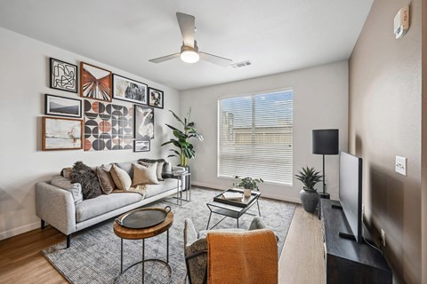 a living room with a couch and a tv