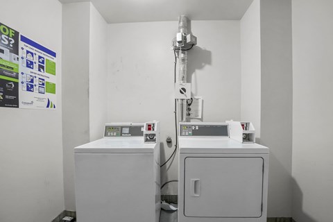 A medical room with a machine and a cabinet.