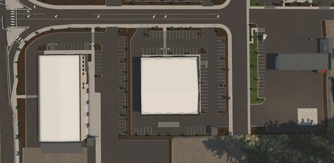 an aerial view of a parking lot with two parking spaces