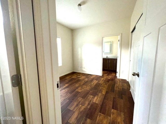a room with a hard wood floor and a door