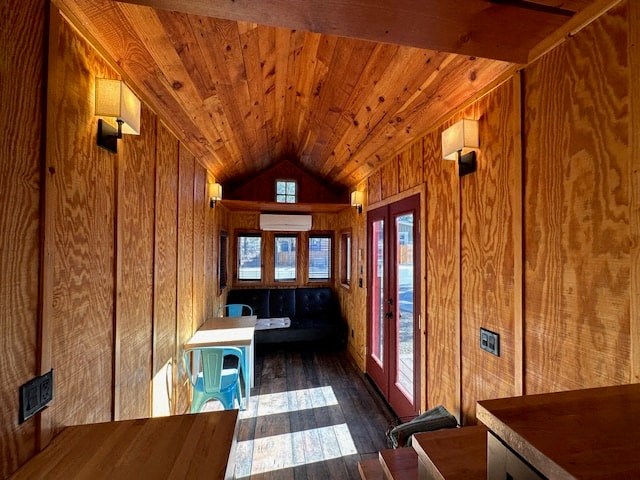 the inside of a wooden cabin with a table and chairs