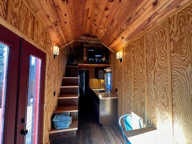 a tiny house with a kitchen and a staircase