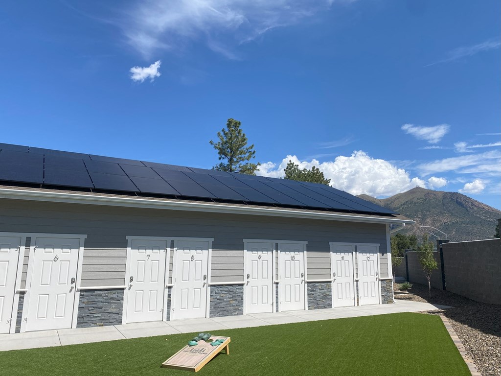 front of a building with solar panels on the roof