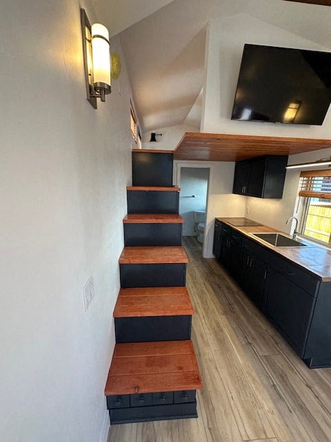 a staircase in a small house with a kitchen