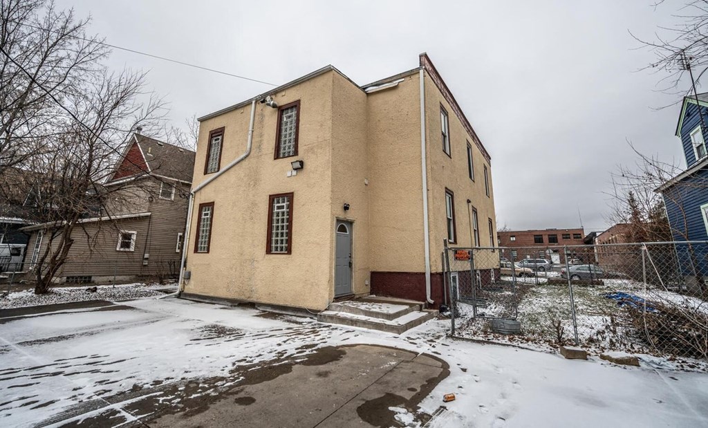 a house with a yard covered in snow