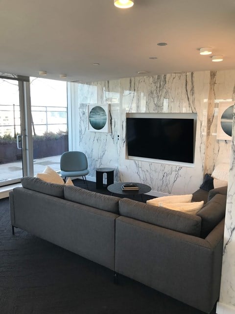 a living room with a couch and a table and a television