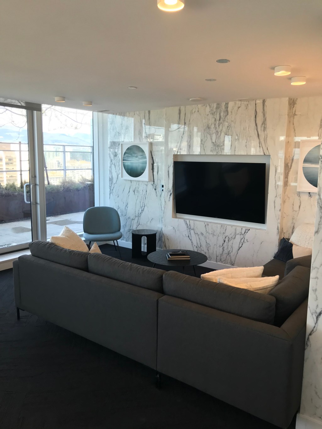 a living room with a couch and a table and a television