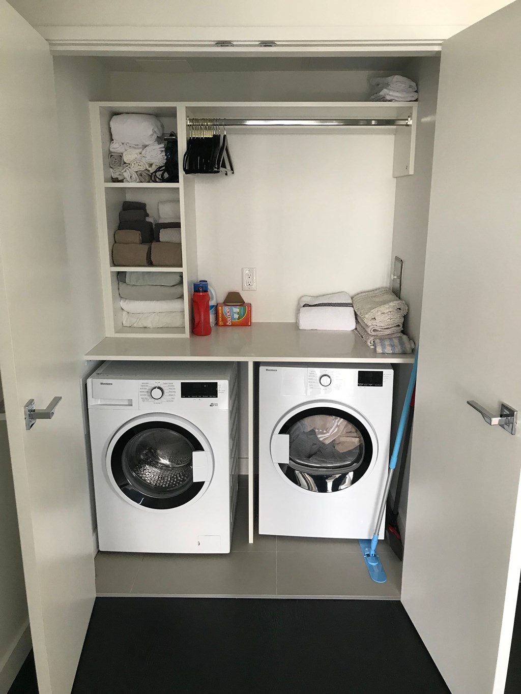 a small laundry room with a washing machine and a dryer