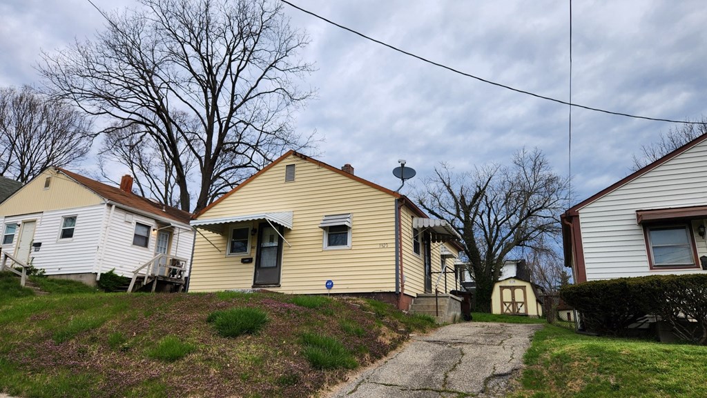 a row of houses on a hill with a sidewalk