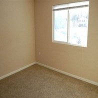 an empty room with a window in it