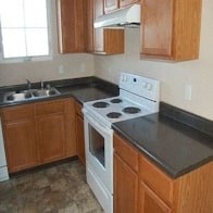a kitchen with a stove and a sink
