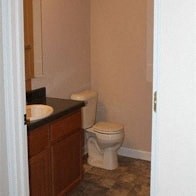 a bathroom with a toilet and a sink