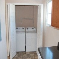 a laundry room with two washes and a dryer in it