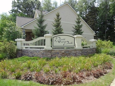 A house with a sign that says "Prestige Estates".