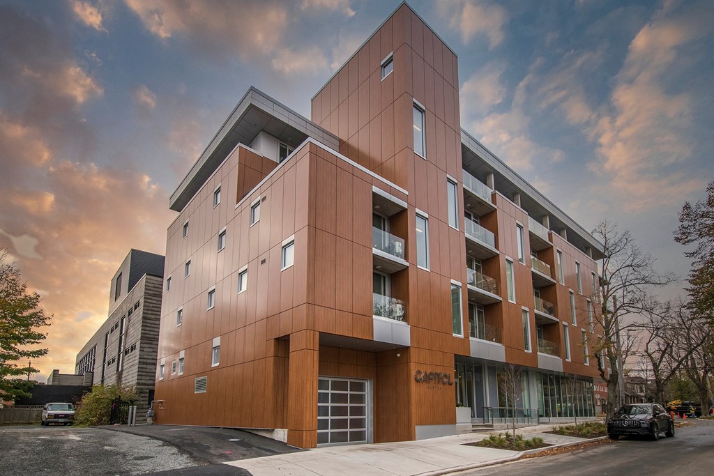 a new apartment building on the corner of a street
