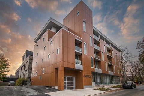 a new apartment building on the corner of a street