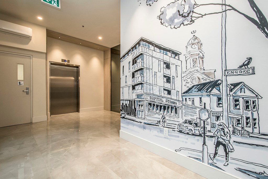 a mural of a city street in a lobby of a building