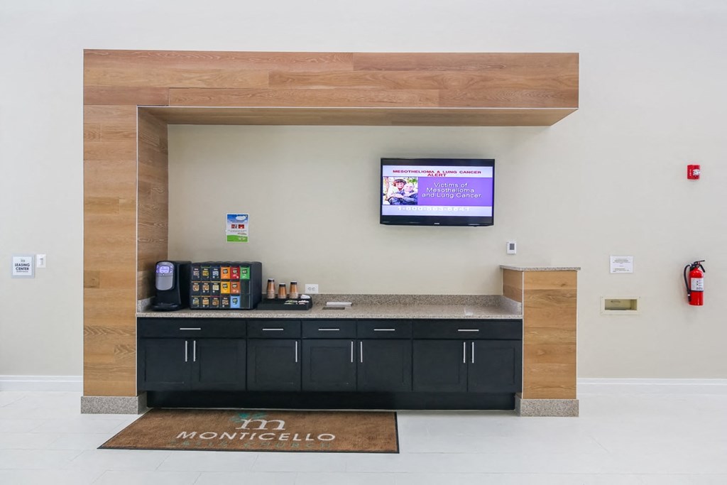 a counter in a room with a tv on the wall