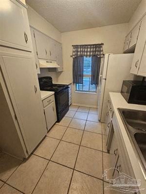 a kitchen with a sink and a refrigerator