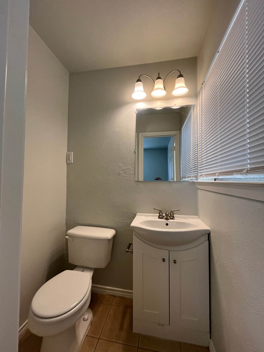 a small bathroom with a toilet and a sink