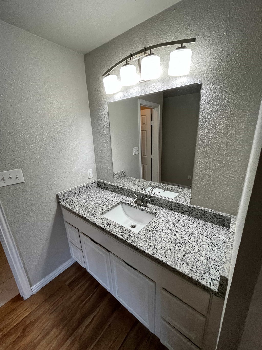 a bathroom with a sink and a mirror