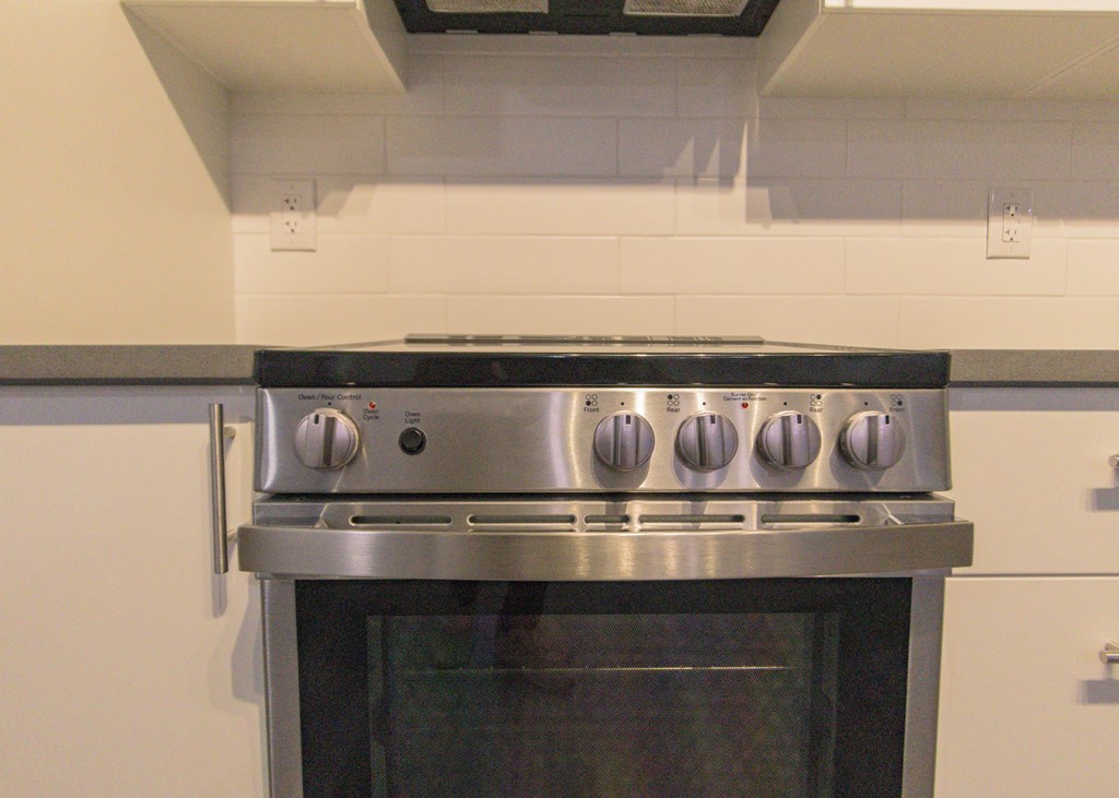 a stainless steel stove top oven in a kitchen
