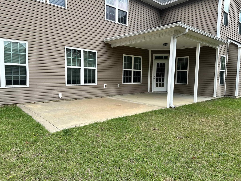 a covered porch in front of a house