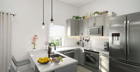 a kitchen with stainless steel appliances and a sink