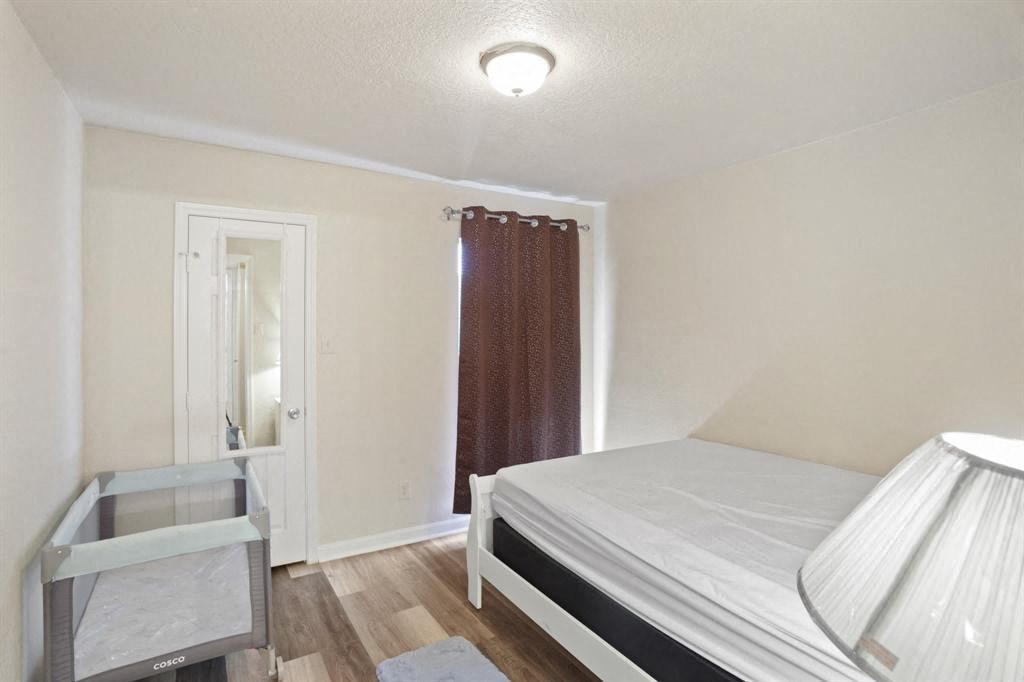 a bedroom with a bed and a glass table