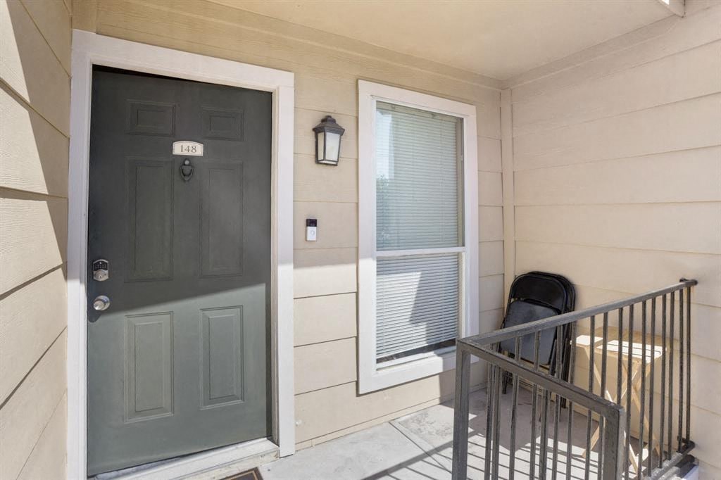 the front door of a house with a wheelchair in front of it