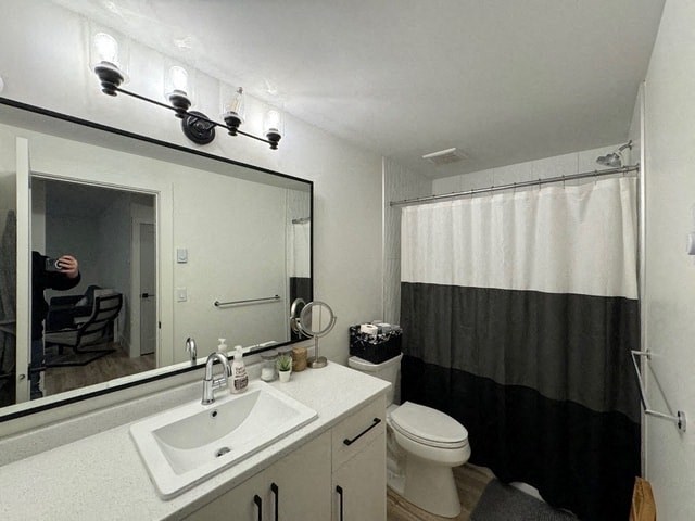 a bathroom with a black and white shower curtain
