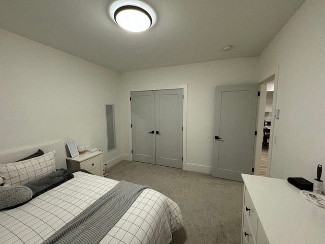 a white bedroom with a bed and a closet