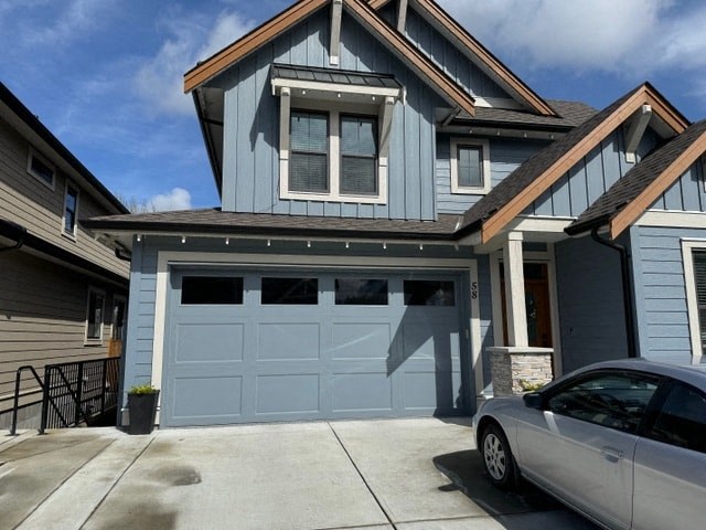 a blue garage door in front of a house