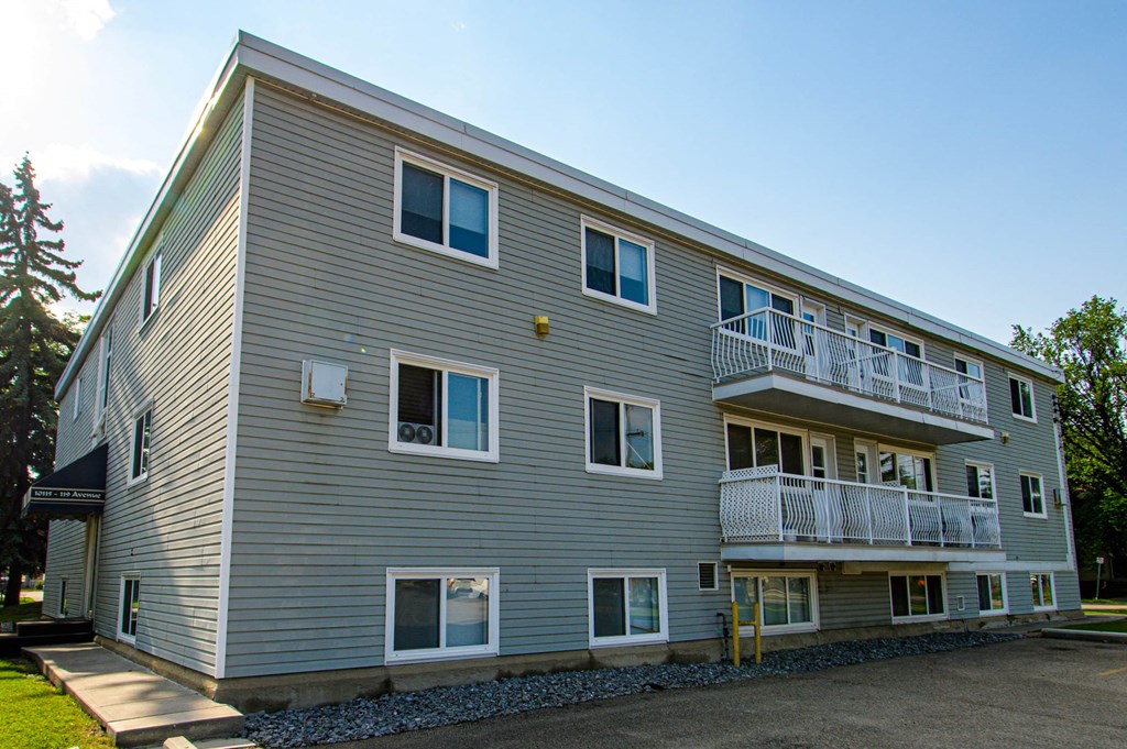 the exterior of an apartment building with balconies