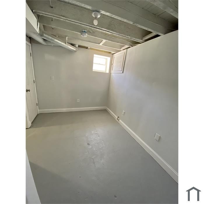 A room with a window and a door.