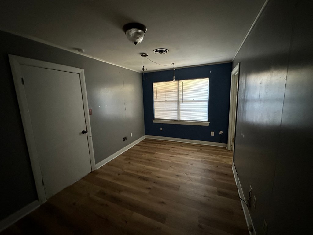 a room with blue walls and a window and a door