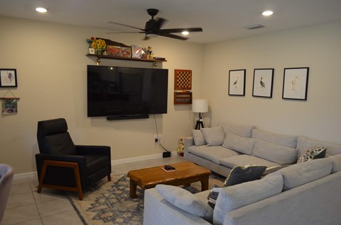a living room with couches and a tv