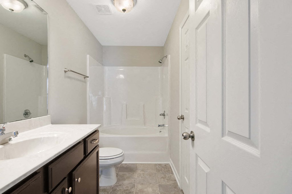 a bathroom with a sink toilet and a shower