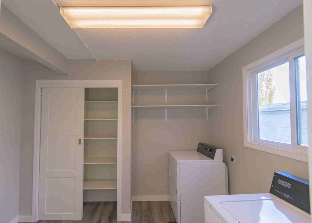 a small laundry room with a washer and dryer in it