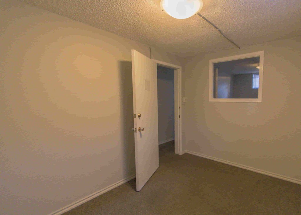 a room with a door and a window