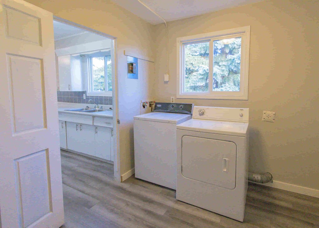 a full view of a laundry room with a washing machine