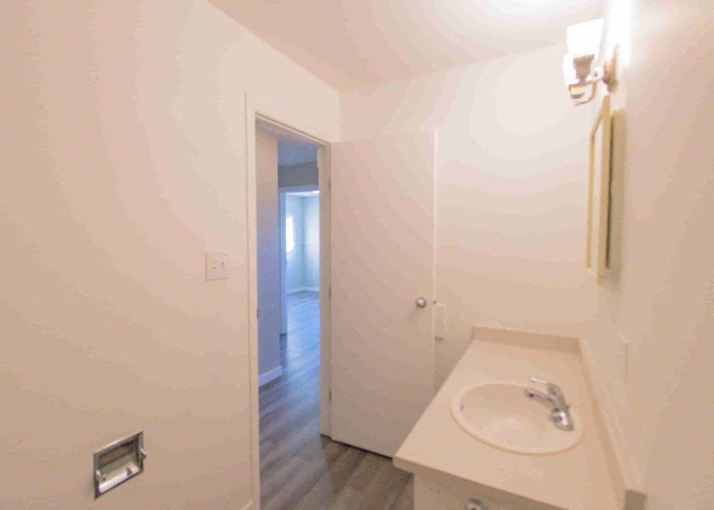 a small bathroom with a sink and a mirror