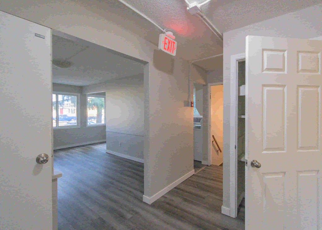 a view of the living room from the hallway of an empty house