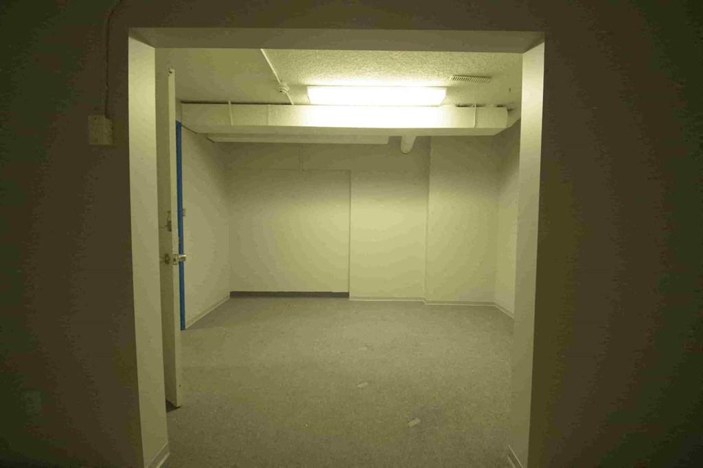an empty room with a door open