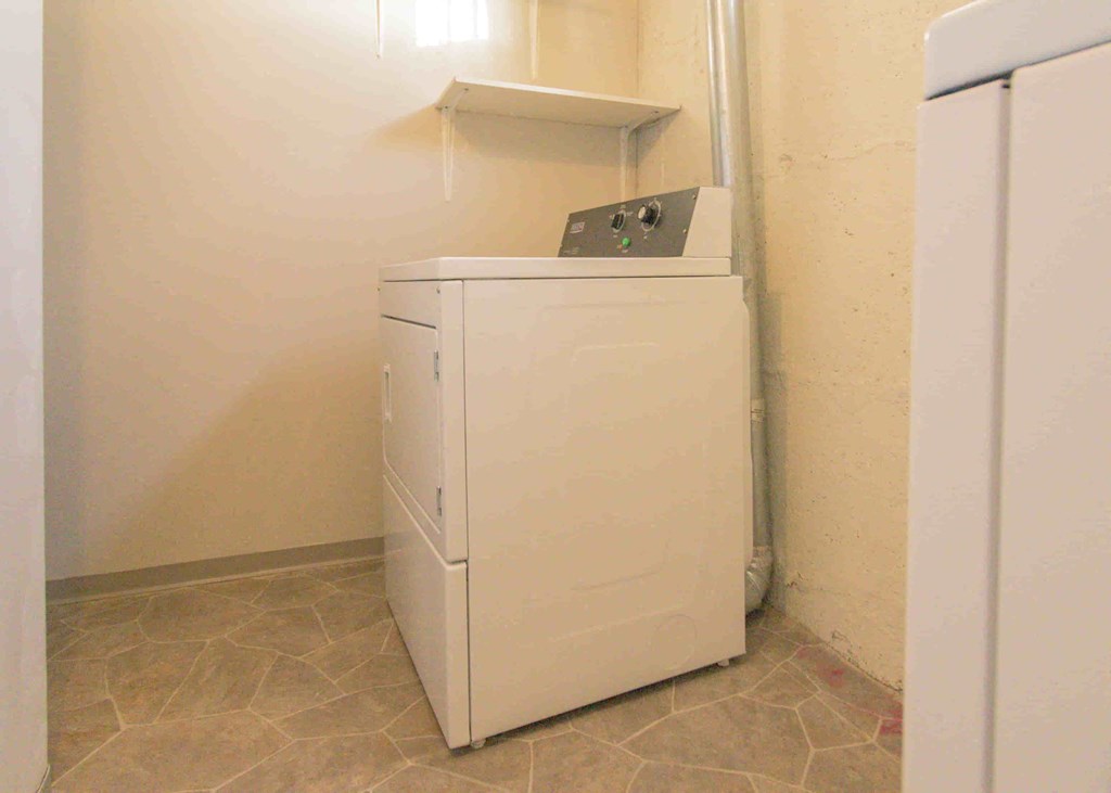 a refrigerator and freezer in a room with a closet