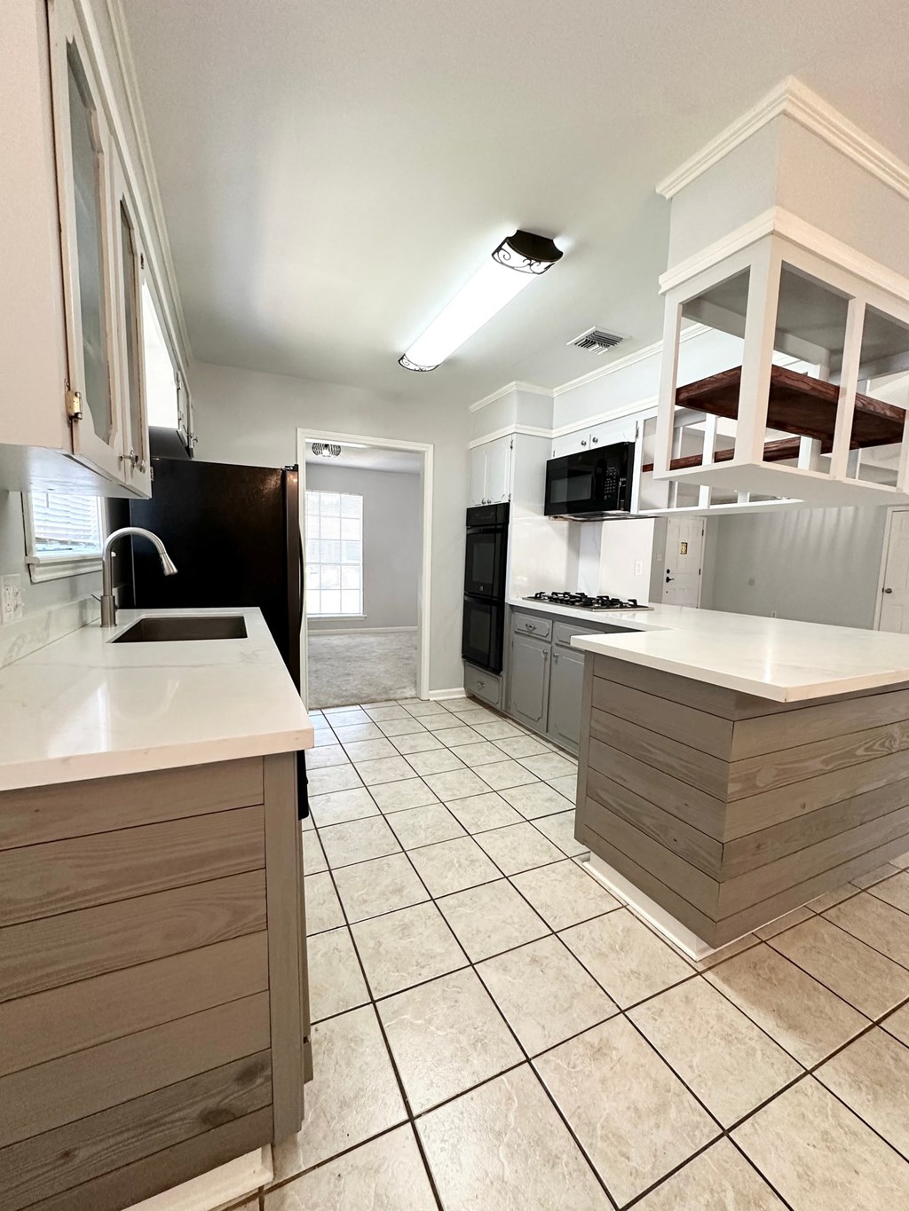 a view of a kitchen with a sink and a counter top