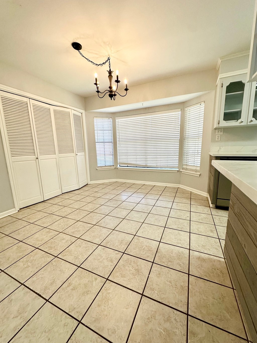 a kitchen and dining room with a chandelier