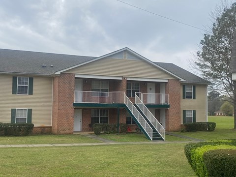 a house with a balcony on the side of it