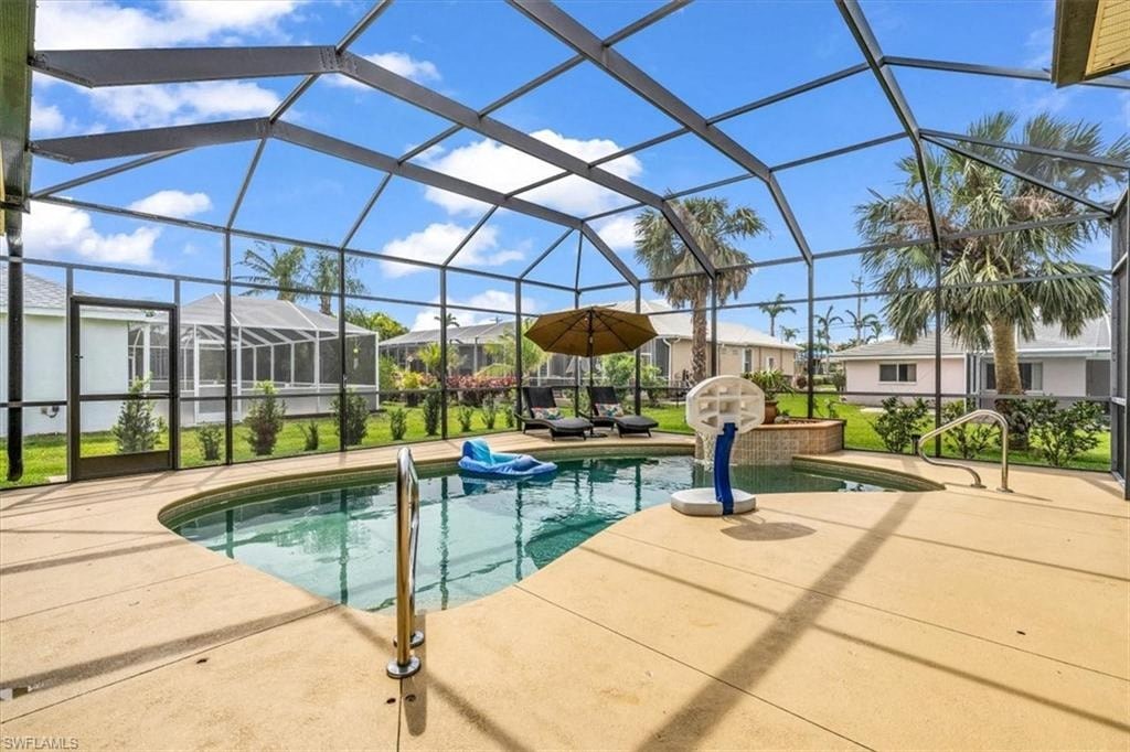 the swimming pool is under a large greenhouse with a pool and spa