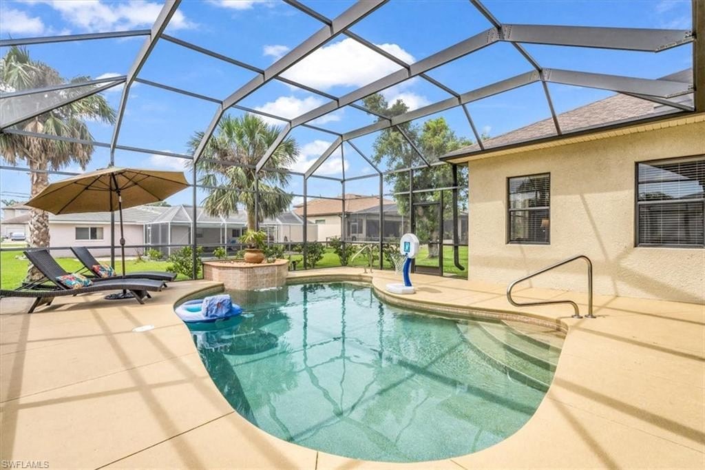 a pool with a house with a glass roof over it